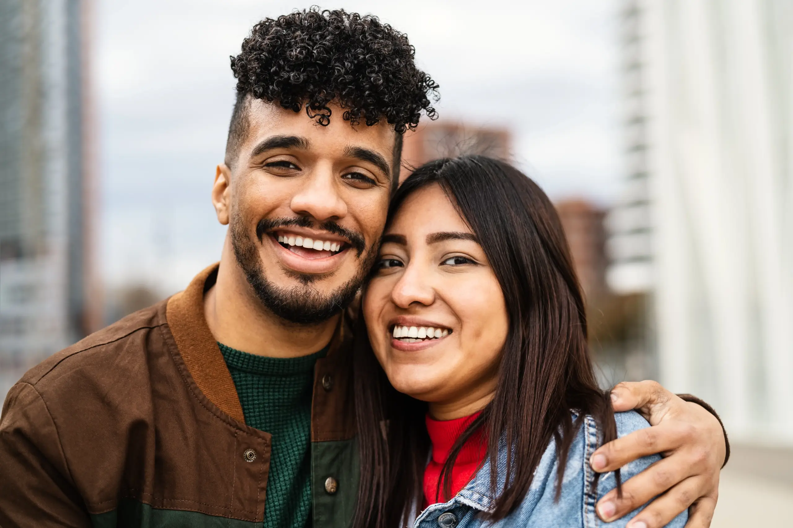 couple smiling to the compassionate dental team after tooth extraction