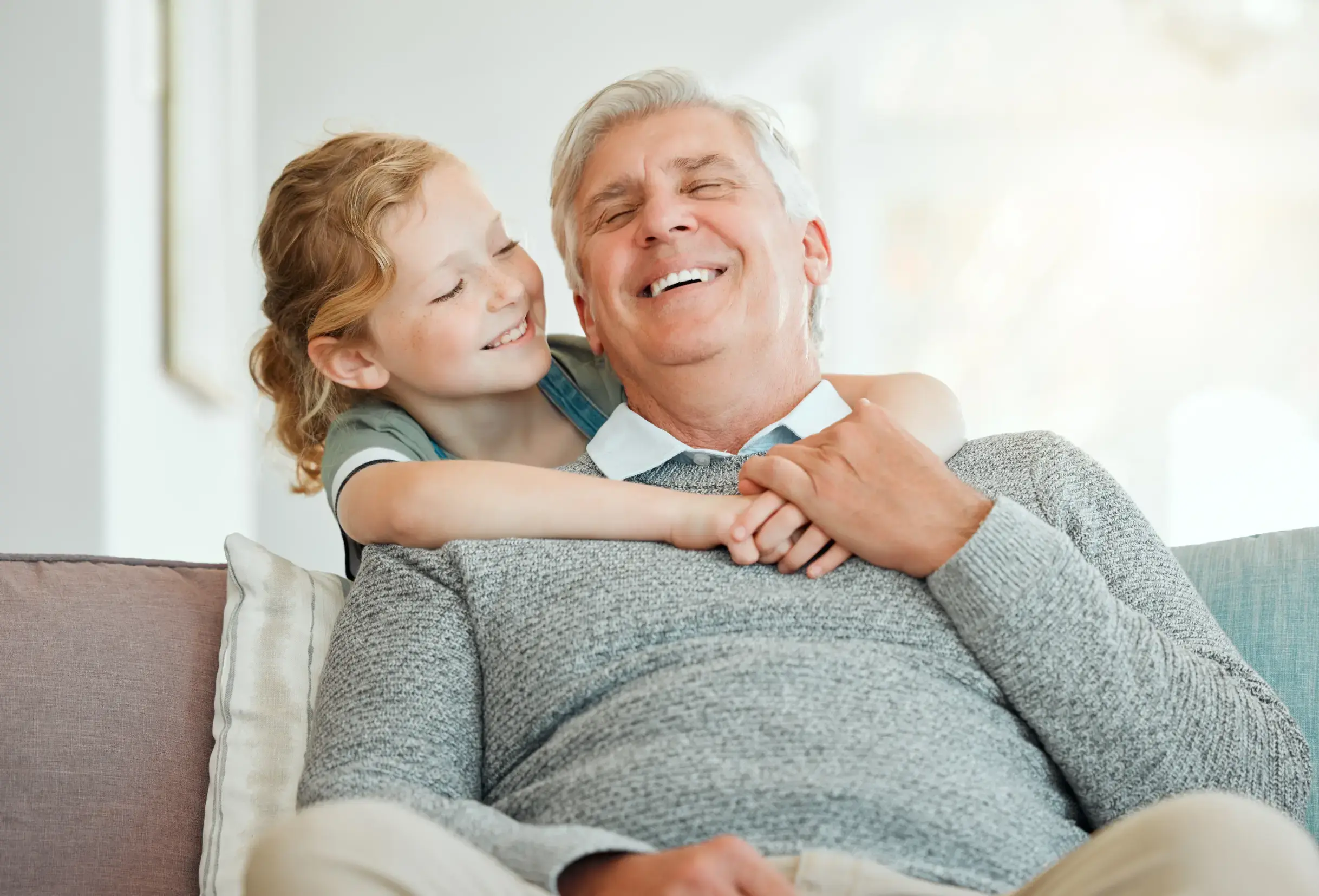 Happy grandfather after a successful dental implant