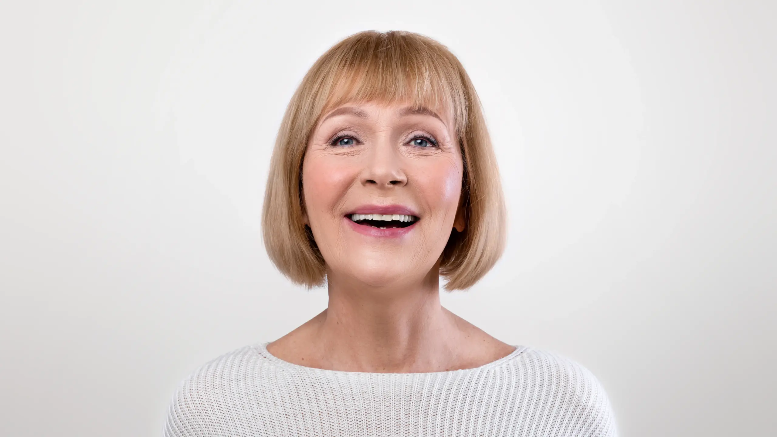 the lady is thankful for the osseous surgery techniques given by trusted dentist in Geneva IL